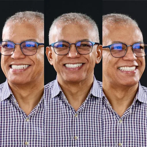 Paciente sorrindo após reabilitação oral com o Dr. Michel Moraes